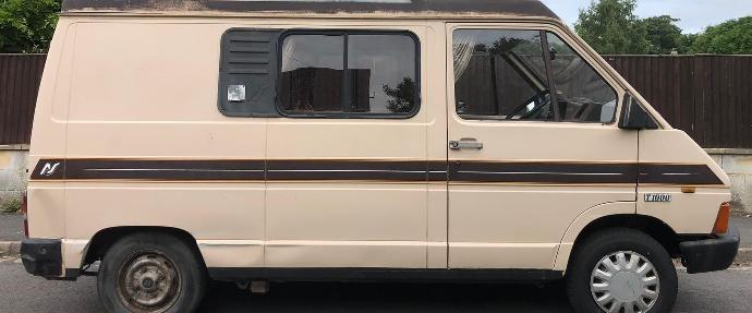 Van with a sliding aluminium window frame